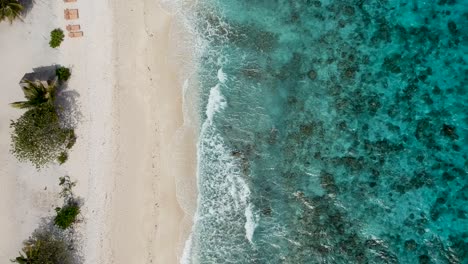 Drone-footage-of-crystal-clear-blue-water-and-waves-on-the-shore-of-beach-in-Cebu-Philippines-5