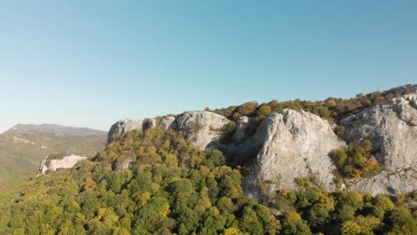 Aerial-panning-shot-around-high-mountain-cliffs-2