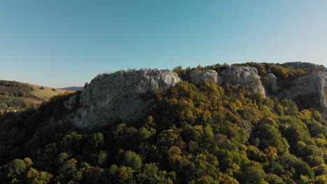 Aerial-panning-shot-around-high-mountain-cliffs-3