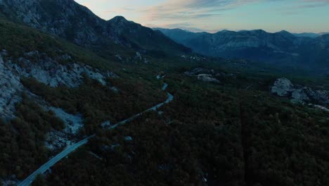 Aerial-medium-shot-of-mountain-road-after-sunset-2