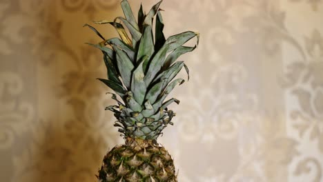 Rotating-Sweet-Pineapple-Ananas-On-The-Table-1