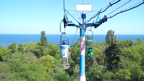 Ropeway-with-blue-sea-and-green-trees-on-backgroud