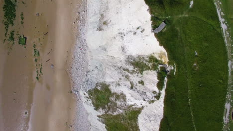 Bird's-view-aerial-footage,-following-a-flying-gull,-shot-at-Le-Petit-Blanc-Nez,-Escalles-on-the-Opal-Coast,-France