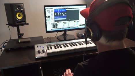 Musician-enjoying-his-music-at-computer