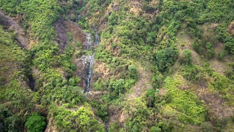 Panning-down-aerial-drone-view-of-waterfalls-in-the-ecuadorian-forest-of-Bucay-1