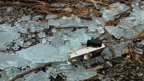 Slide-over-broken-safety-glass-with-twigs-and-debris-mixed-in