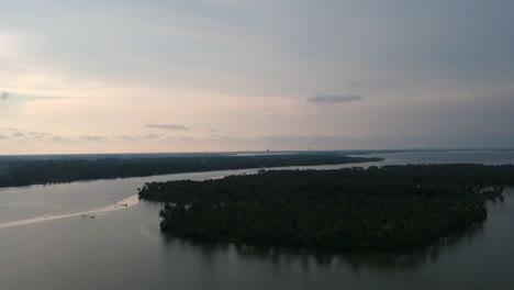 Beautiful-aerial-shot-of-a-backwater-island,Vembanad-lake-Asia,Sunset-water-Transportation