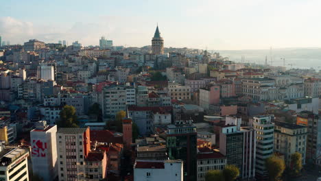 Early-morning-aerial-drone-flight-towards-Galata-Tower,-Istanbul,-Turkey