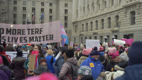 Large-group-of-protesters-with-LGBTQ-signs-gathered-on-the-streets-of-Washington-DC-participating-in-the-Women's-March