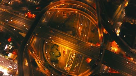 drone-footage-from-a-Highway-crossing-in-Buenos-Aires,-at-night