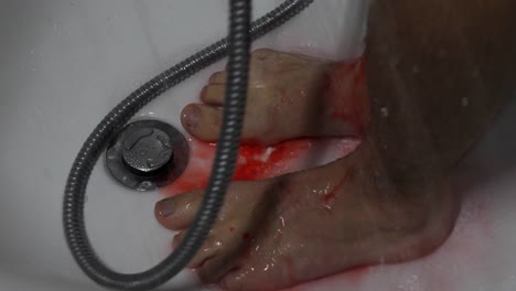 Washing-away-sinful-blood-in-the-bathtub-in-psycho-style,-closeup