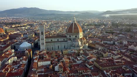 Duomo-Cathedral-of-Santa-Maria-del-Fiore,-baptistery-and-panoramic-view-of-Florence-Italy,-Aerial-approach-shot