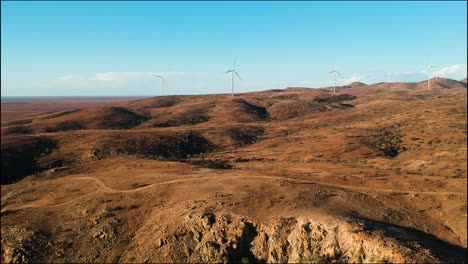 Wind-farm-towers-rise-majestically-above-the-barren-desert-landscape