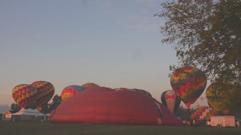 A-Time-Lapse-of-Hot-Air-Balloons-Filling-Up-at-a-Hot-Air-Balloon-Festival-on-a-Summer-Morning
