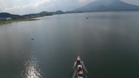 Aerial-View-of-Moving-Single-Motor-Fishing-Boat-on-Lake-Buhi-Camarines-Sur-Philippines