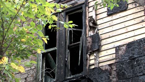Urban-Decay,-medium-shot-of-burnt-down-house-in-Detroit,-Michigan,-USA-1