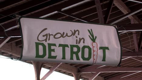 Sign-"Grown-In-Detroit"-in-Detroit-Eastern-Farmas-Market,-Michigan,-USA