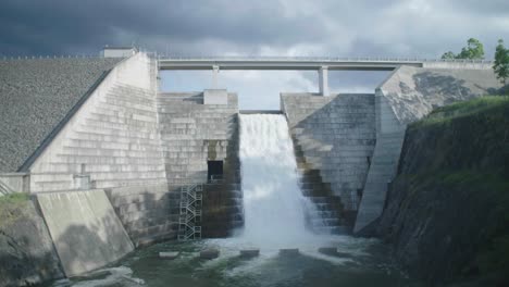 Wide-shot-of-a-Dam-water-flowing-on-an-overcast-day