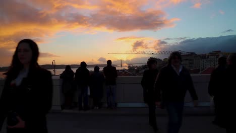 People-look-over-the-a-beautiful-view-over-the-Tagus-river-in-Lisbon,-Portugal