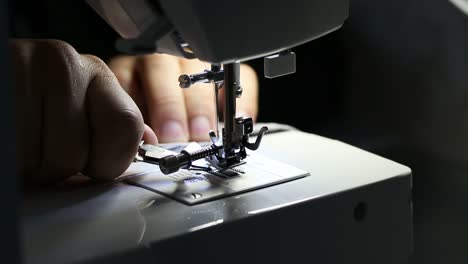 With-Small-Metal-Scissors-Preparing-Sewing-Thread-In-Sewing-Machine