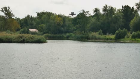 Border-Intelligence-Tower-Among-The-Trees-On-The-Other-Side-Of-The-River