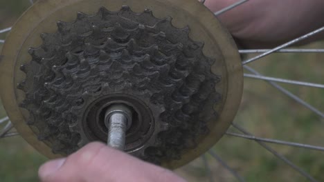 The-Man-Fingers-Unscrew-The-Bicycle-Wheel-Axle-Nut