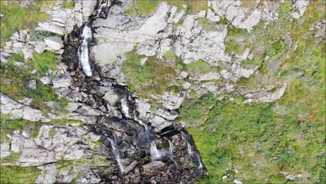 Waterfall-aerial-shot-from-below-to-above