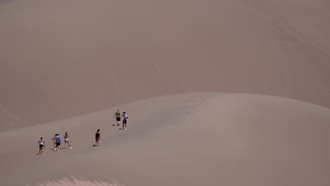 People-walking-on-sand-dunes