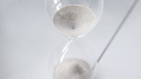Hourglass-sand-falling-in-slow-motion-from-above