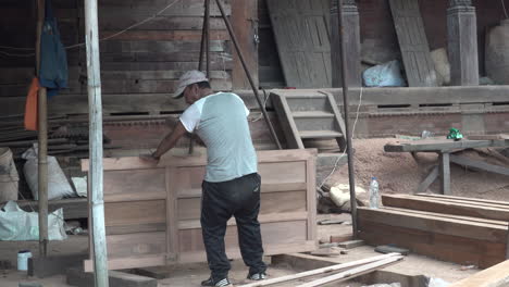 Kathmandu,-Nepal---November-16,-2019:-A-man-building-a-wooden-door