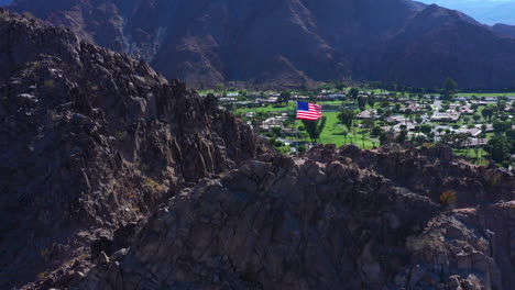 Patriot-american-flag-waving-on-mountain-at-Indio-California