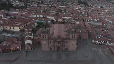4k-daytime-aerial-drone-footage-over-the-main-Cathedral-from-Plaza-de-Armas-in-Cusco,-Peru-during-Coronavirus-lockdown