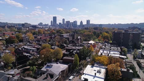 A-daytime-slow-forward-tilt-up-aerial-establishing-shot-of-Pittsburgh's-Manchester-neighborhood