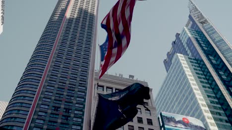 Low-angle-view-of-the-Stars-and-Stripes-American-USA-flag-blowing-in-the-wind-in-Times-Square