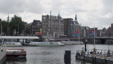 Tilt-down-to-Canal-in-historic-city-centre-of-Amsterdam