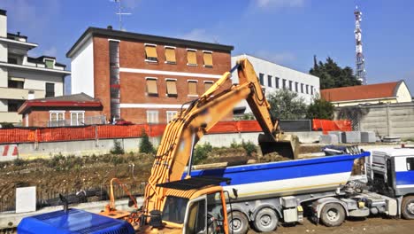 Heavy-duty-excavator-on-housing-project-moving-land-into-a-truck
