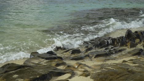 Gentle-waves-breaking-on-rocky-coast-of-tropical-island-in-Fiji
