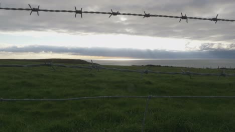 Barbed-Wire-Fence-At-The-Seaside-On-A-Cloudy-Day