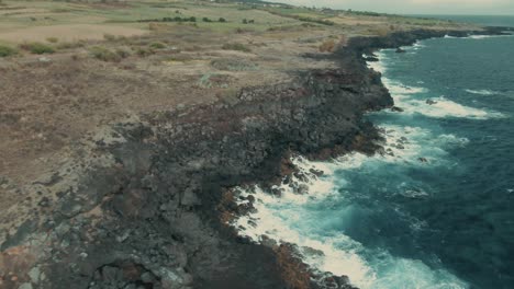4k-Aerial-dry-volcanic-coast-on-cloudy-day-Drone-dolly-in-shot