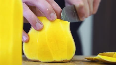 Chef-chopping-the-skin-from-pumpkin