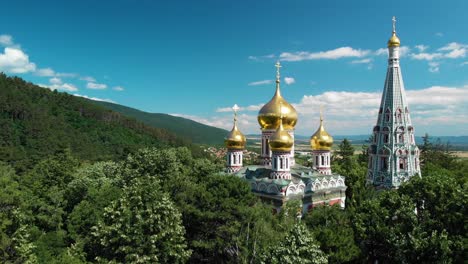 Shipka-Memorial-Church,-Memorial-Temple-Of-The-Birth-of-Christ-With-Green-Trees-In-Foreground