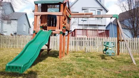 Very-windy-day,-swingset-swings-are-blowing-everywhere