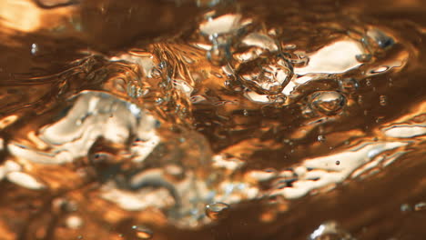 Boiling-liquid-gold-with-ice-cubes-4