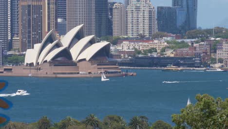 Slow-motion-shot-of-Sydney-Opera-House-Cityscape-with-boats-and-yacht-Bennelong-Point-Sydney-NSW-Australia-4K