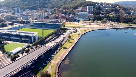 Drone-aerial-pan-shot-of-scenic-Brian-McGowan-Bridge-Gosford-City-CBD-with-Mariners-football-stadium-Central-Coast-tourism-NSW-Australia-3840x2160-4K