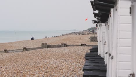 South-England-pebbly-ocean-beach-coast-line-shot-with-huts-England-UK-3840x2160-4K