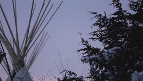 Camera-pan-of-Native-American-tipis-with-pretty-sky