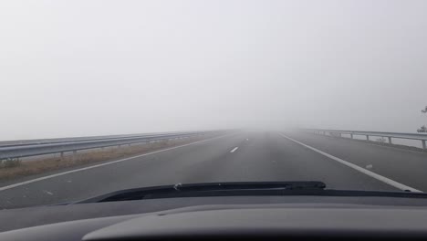 Cars-Driving-And-Speeding-On-Foggy-Asphalt-Highway---POV,-wide-shot
