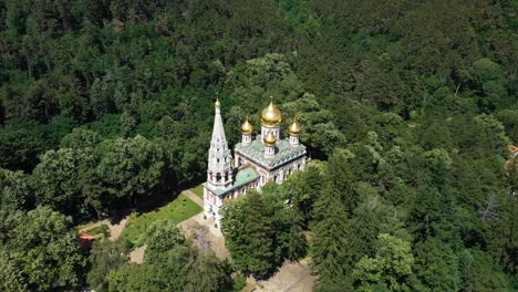 Shipka-Monastery-With-Golden-Domes-Surrounded-By-Green-Forest-In-Bulgaria