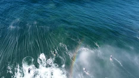 Drone-aerial-shot-of-surfers-duck-diving-big-wave-in-Pacific-Ocean-Wamberal-Central-Coast-NSW-Australia-3840x2160-4K